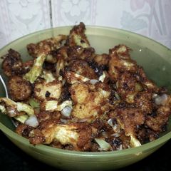 A picture of Cauliflower with spring onion &spices.