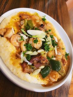 A picture of Shrimp + Grits w/ Pork Belly.
