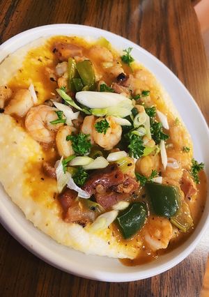 A picture of Shrimp + Grits w/ Pork Belly.
