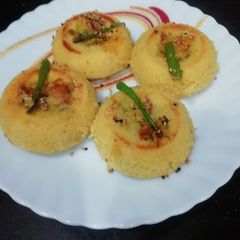 A picture of Potato Ball Stuffed Moong dal & sago pearls idli.