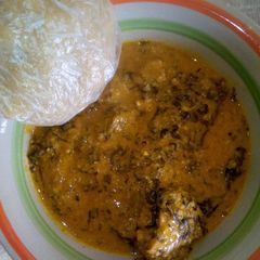 A picture of Groundnut soup and ugali.