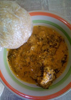 A picture of Groundnut soup and ugali.