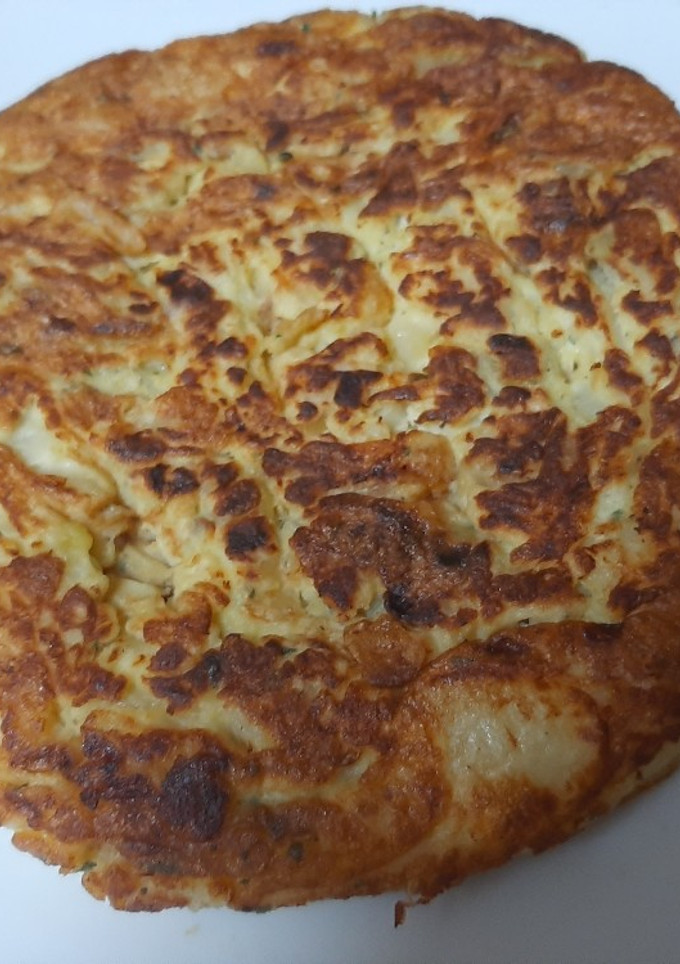 Una foto de Tortilla de patatas con cebolla