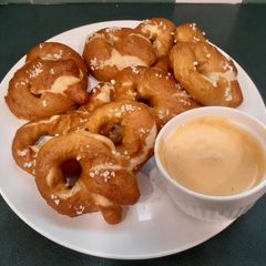 A picture of Soft-baked pretzels & homemade nacho cheese sauce.