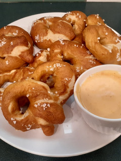 A picture of Soft-baked pretzels & homemade nacho cheese sauce.