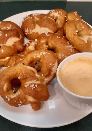 A picture of Soft-baked pretzels & homemade nacho cheese sauce.