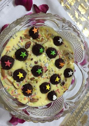 A picture of Floating beet balls in custard.