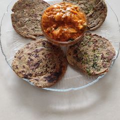 A picture of KAJU CURRY WITH GARLIC- LACHHA PARATHAS.