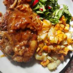 A picture of Chuletas a la BBQ.