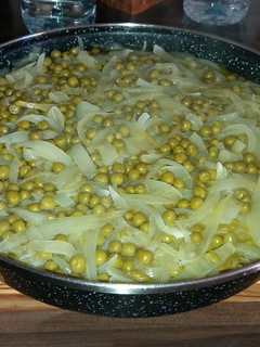 Una foto de Guisantes encebollados