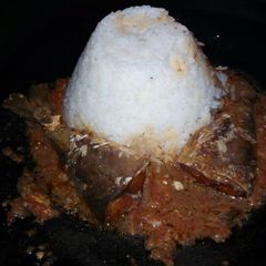 A picture of Rice and fish curry.
