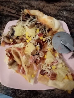 Una foto de Pizza Hawaiana