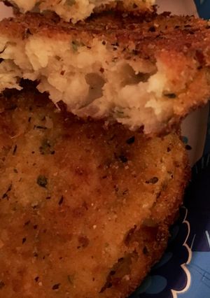 A picture of Chili Soup with Mashed Potato Cakes.