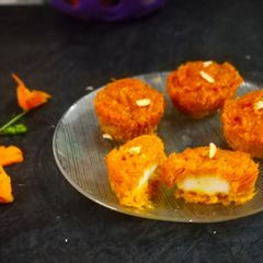 A picture of Baked cheese stuffed carrot muffin.