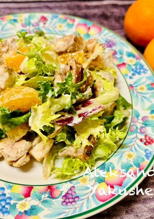 A picture of Salad with chicken and tangerines.