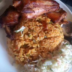 A picture of Fried rice an chicken.