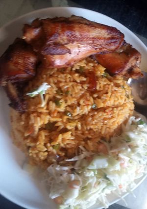 A picture of Fried rice an chicken.