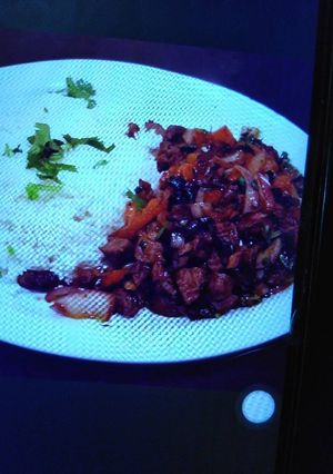 A picture of Beef stew and rice.