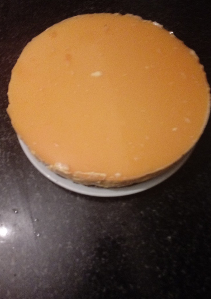 Una foto de Tarta de queso y zumo de mandarina