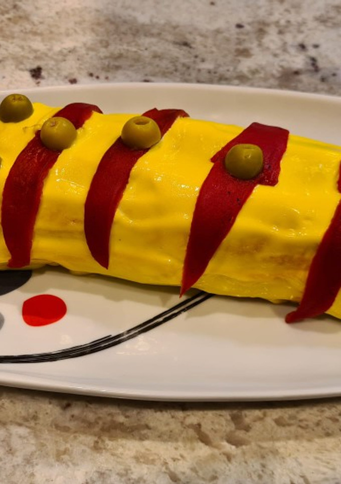 Una foto de Brazo de gitano de atún con pan de molde