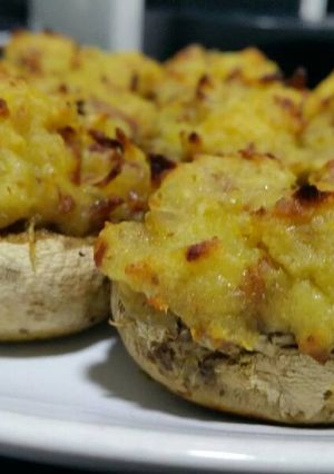 A picture of Stuffed mushrooms with sweet potato and crispy Iberian ham.