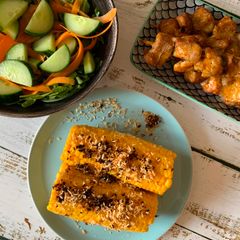 Grilled sweet corn with coconut crumbs A picture of Grilled sweet corn with coconut crumbs.