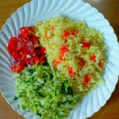 A picture of Coconut rice with buttered cabbage and Kachumbari.