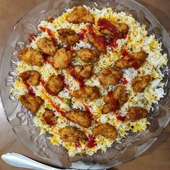 A picture of Chicken hot shots with Arabian rice.