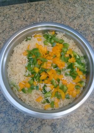 A picture of Steamed rice with peppers.