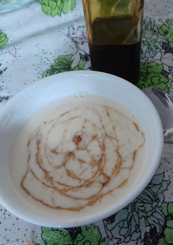 Una foto de Arroz con leche y salsa de caramelo