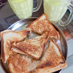 A picture of Cheese,potatoes,onion toast sandwich 🍞 with Haldi wala milk.