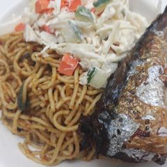 A picture of Spagetti,coleslaw and fried fish.