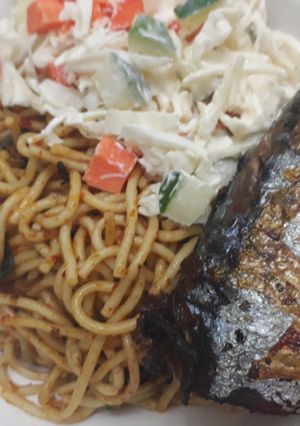 A picture of Spagetti,coleslaw and fried fish.