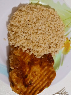 A picture of Pork rib with pumpkin and whisky sauce and rice.