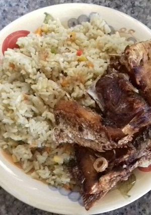 A picture of Coconut rice,mix vegetables with fresh fish.