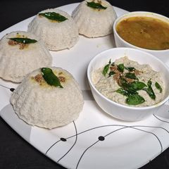 A picture of Idli in muffin with peanuts chutney & samber.