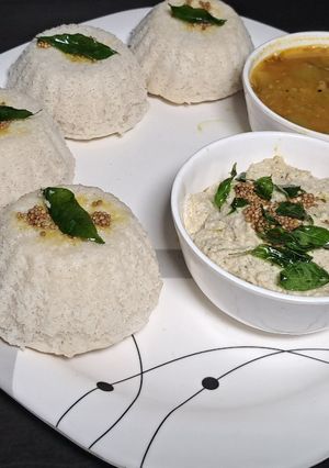 A picture of Idli in muffin with peanuts chutney & samber.