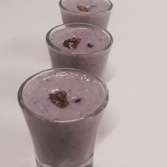 A picture of Walnuts and blueberry smoothie shots.