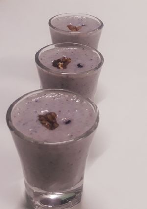 A picture of Walnuts and blueberry smoothie shots.