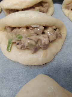 Una foto de Pan Bao con secreto ibérico, ajitos y salsa de mayonesa hoisin
