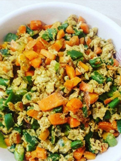 A picture of Scrambled eggs with veggies.