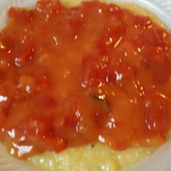 A picture of Grits, Smoked Sausage, and Tomato Gravy.