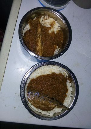 A picture of Rice and stew with fish.