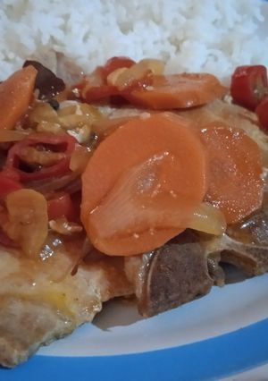 Una foto de Chuletas de cerdo en escabeche estilo Carmen
