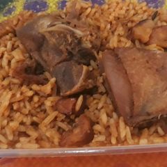 A picture of Jollof rice with chicken.