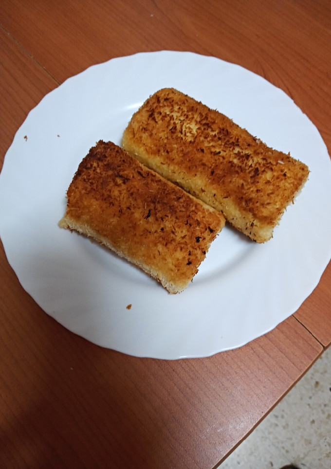 Una foto de Rollitos de manzana, melocotón y crema pastelera