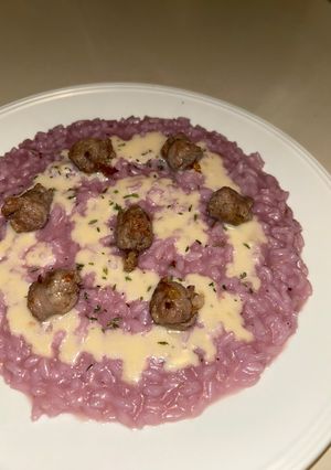 A picture of Risotto with Red Cabbage, Parmesan Fondue, and Sausage.