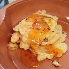 A picture of Gluten free corn fritters with mango 🥭 chilli sauce.