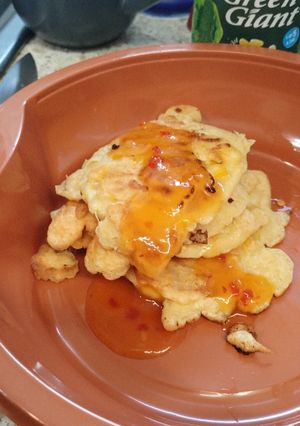 A picture of Gluten free corn fritters with mango 🥭 chilli sauce.