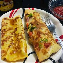 A picture of Dim Gola Rooti - plain and masala(Bengali pancake).